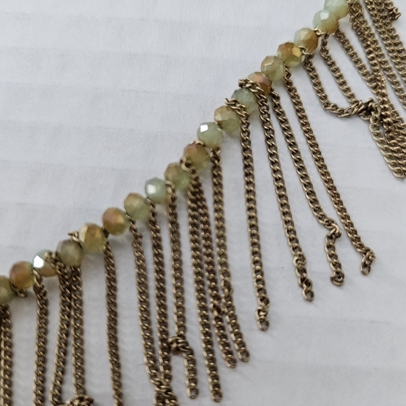 Freedom gold and green long necklace with a boho feeling fringe. - Picture 3 of 12